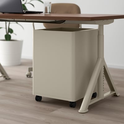 Large beige office drawer unit on wheels under a desk with soft-close drawers.