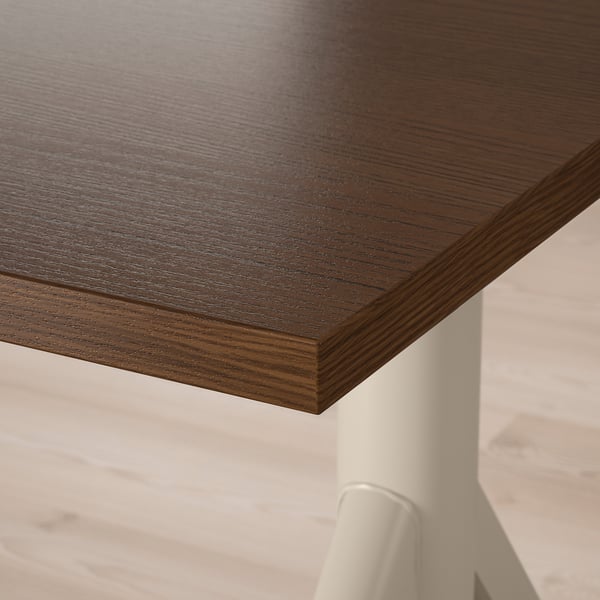 Close-up of smooth, dark wooden tabletop with visible grain texture and rounded edges.