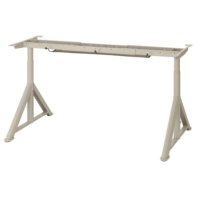 IDÅSEN adjustable desk frame in beige, triangular base, lightweight, height-adjustable.