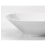A pristine white deep bowl, smoothly curved and sleek, showcasing its fine porcelain finish.