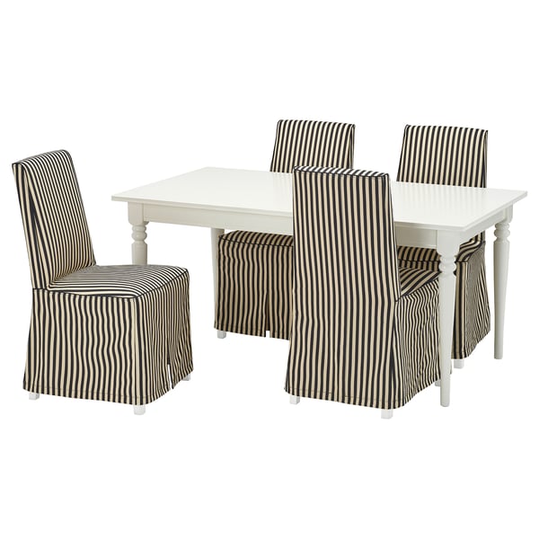 Dining set with white square table and striped chairs. Modern, elegant, black and white stripes on fabric. Stylish and practical.