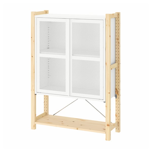 The IVAR storage unit is a light-colored wooden structure with mesh doors. It an open lower shelf and sturdy wooden frame.
