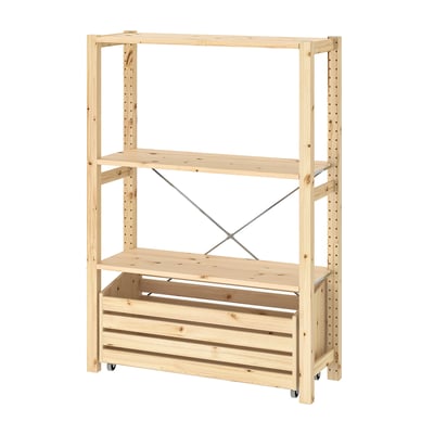 An IVAR light wood storage unit with two shelves and a crated bottom on wheels. Its simple, practical, and mobile.