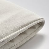 Close-up of soft, durable cushion cover with padded inlay, showcasing quality fabric texture.
