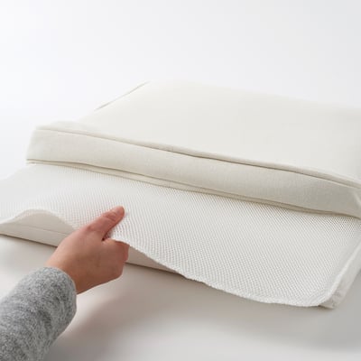 Hand gripping anti-slip, water-resistant, machine-washable outdoor chair cushion.