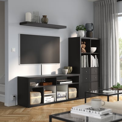 Modern living room with KALLAX black tv stand, shelf, and unit. Tv centered, gray curtains, wooden floor.