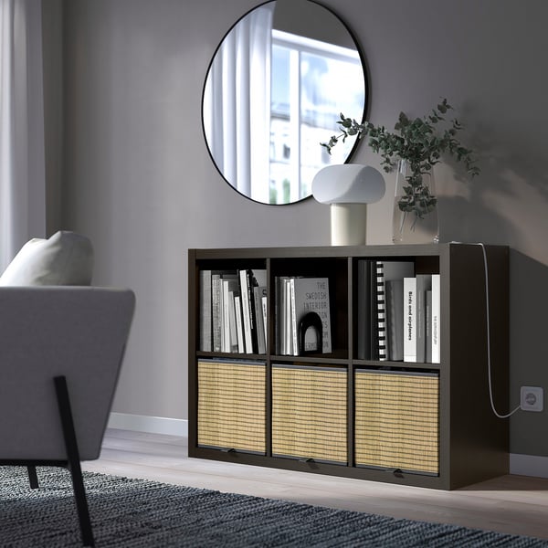 KALLAX bookshelf with books, lamp, plant near window, wider than chair, mirror above
