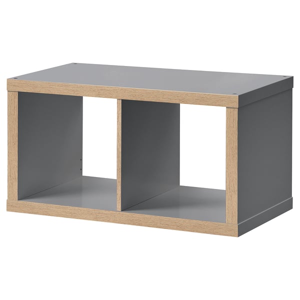 Ikea KALLAX grey shelf unit. Modern rectangular design with open sections, combining grey and wooden materials.