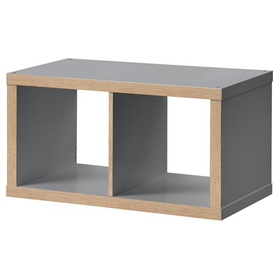 Ikea KALLAX grey shelf unit. Modern rectangular design with open sections, combining grey and wooden materials.