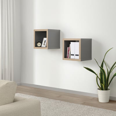 KALLAX shelves with clock, books, files. Modern design in living space with chair, rug, plant.