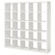 A white KALLAX cube shelving unit. Its square-shaped with multiple open storage compartments, ideal for various uses.