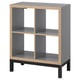 KALLAX gray shelf unit, four cube compartments, sleek modern design with light wood trim and black base, versatile for various uses.