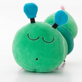 Stuffed green worm toy with blue antennae, emitting soothing sounds. Ideal for baby sensory development.