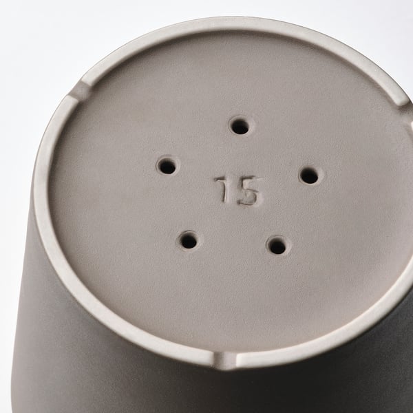 Close-up of a grey plant pots base, labeled 15. Shows drainage holes, smooth surface, and sturdy build.