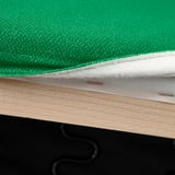 Close-up of green fabric on wood furniture with sturdy straps.