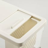Plastic kitchen container with lid and strainer for easy filling and draining.