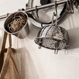 KLOCKREN steamer hangs on wall rack, stainless steel, durable, easy to clean.