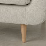 Close-up of sleek, light gray sofa with sturdy wooden leg and clean, modern design.
