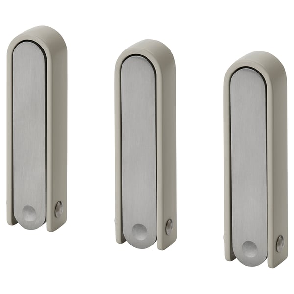 Three silver KLYKET hooks with wavy shape, perfect for hanging items, folds flat, versatile design.
