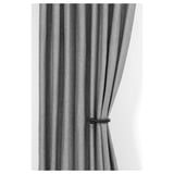 Gray curtains tied back with black tie backs.