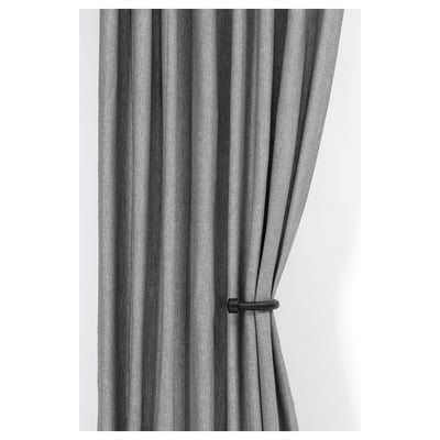 Gray curtains tied back with black tie backs.