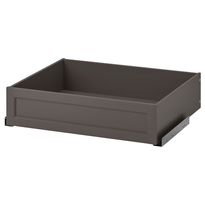 A gray KOMPLEMENT drawer, rectangular in shape with a smooth finish. Its designed for storage and has a modern, sleek appearance.