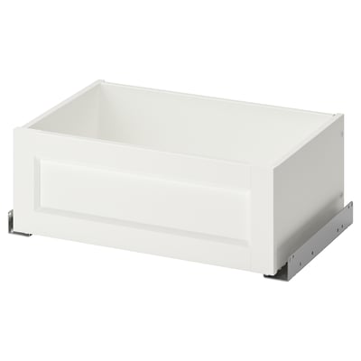 A white KOMPLEMENT drawer with a modern design for pax wardrobe, featuring a sleek frame and partially open front.