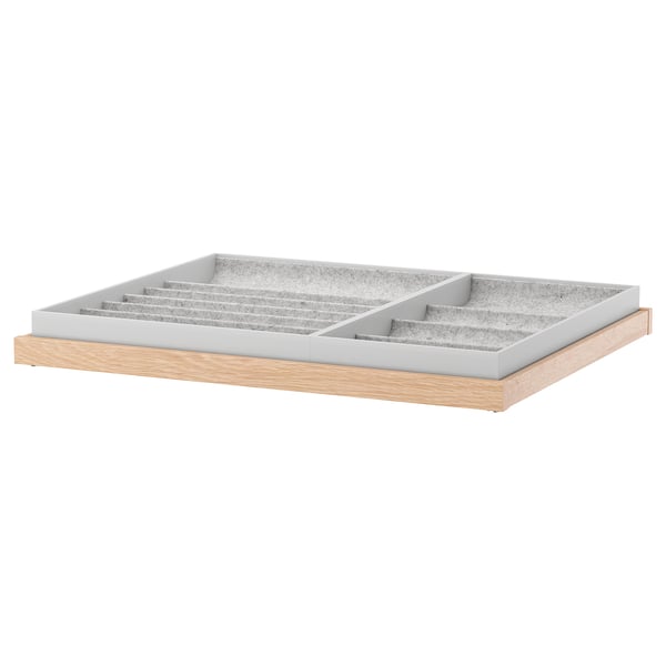 KOMPLEMENT pull-out tray with felt insert for organizing accessories. Wooden base, grey felt, rectangular shape.