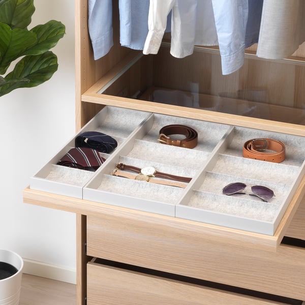 Drawer organizer with felt liners for ties, belts, watches, plus silent pull-out mechanism.