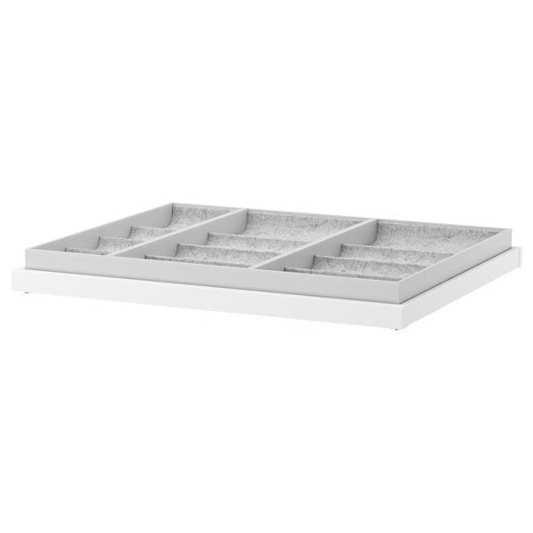 White KOMPLEMENT tray with removable compartments for organizing accessories.