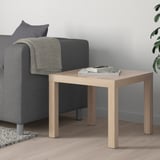 LACK side table, light brown, beside gray sofa, holds magazines.