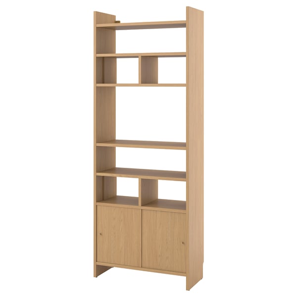A light wooden LÅDMAKARE storage unit with open and closed shelves. Its rectangular, light-colored, and modern.