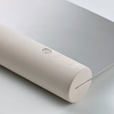 Cylindrical white plastic tool with embedded stainless steel blade, branded LÄTTBAKAD.