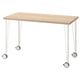 LAGKAPTEN: light wood desk with white legs and black casters. Simple, modern design.