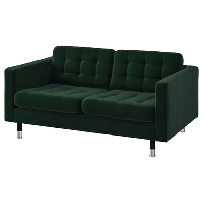 Modern green velvet sofa, chrome legs, tufted back & seat, cozy & stylish.