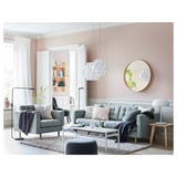 Modern living room with grey LANDSKRONA sofa, wooden coffee table, and white pendants.