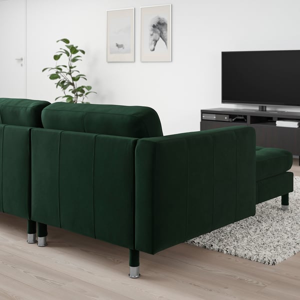 Modern living room with green LANDSKRONA sofa, sleek legs, cushions, tv, art.