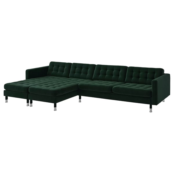 Dark green, l-shaped section sofa, velvet fabric, chrome legs, tufted cushions.