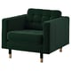 Green tufted armchair with wooden legs.