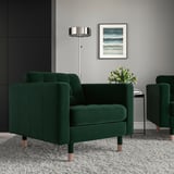 Modern living room with two deep green, velvet LANDSKRONA armchairs, wooden legs. Gray walls, floor lamp, plants, art. Cozy, stylish vibe.