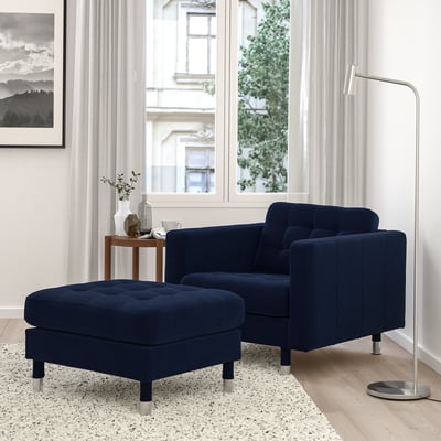 Modern living room: navy blue velvet armchair & ottoman, chrome legs. Large, comfy & stylish.