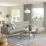 Modern living room: LÅNGARYD sofa, coffee table, lamp, plants, curtains, rug, bright.