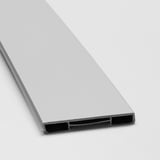 Close-up of smooth, light grey LERHYTTAN kitchen plinth with sleek, bevelled edges and secure clips.