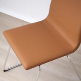 Modern chair with cushioned seat and back for comfort. Brown, coated fabric cover, chrome sled base, ideal for dining.