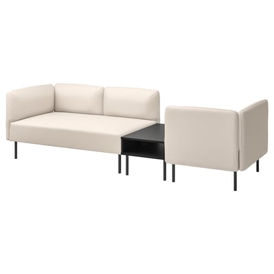 Modern beige modular sofa with black coffee table, minimalist design, versatile.