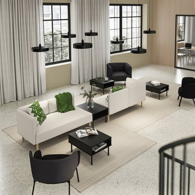 Modern living room with white LILLEHEM sofa, black chairs, coffee tables, and pendant lights, large windows with curtains.
