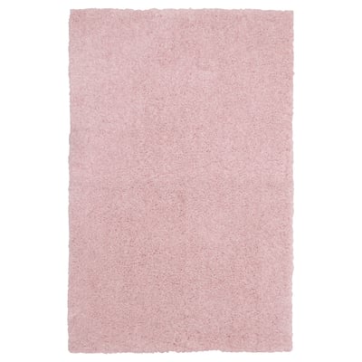 Light pink, rectangular, plush area rug, soft and cozy, made from recycled polyester.