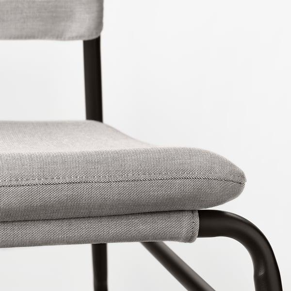 Modern minimalist chair with sleek metallic frame and plush cushioned seat ensuring comfort and durability.