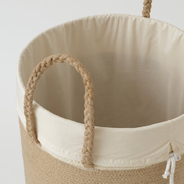 Large woven basket with braided jute handles and removable inner bag.