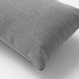 High-quality, textured grey decorative pillow on a plain background.